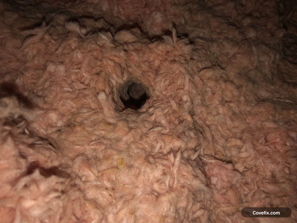 A gap in attic insulation above a room