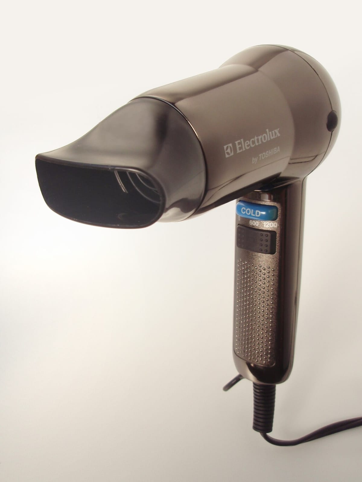A handheld electric hair dryer on a white background