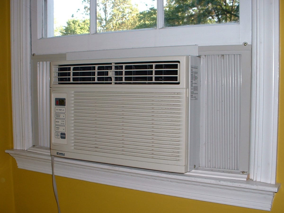 A window air conditioner fitted into a sash window from outside
